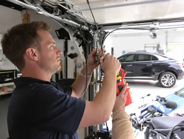 North Reading Garage Door Repair safety certified technician performing cable replacement in North Reading