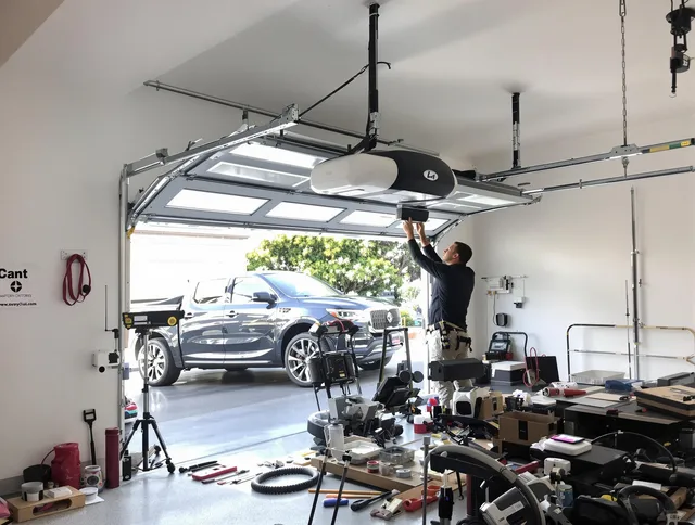 North Reading Garage Door Repair specialist installing smart garage door opener system in North Reading home