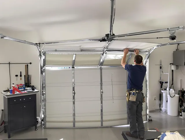 North Reading Garage Door Repair specialist performing precise section replacement on North Reading garage door